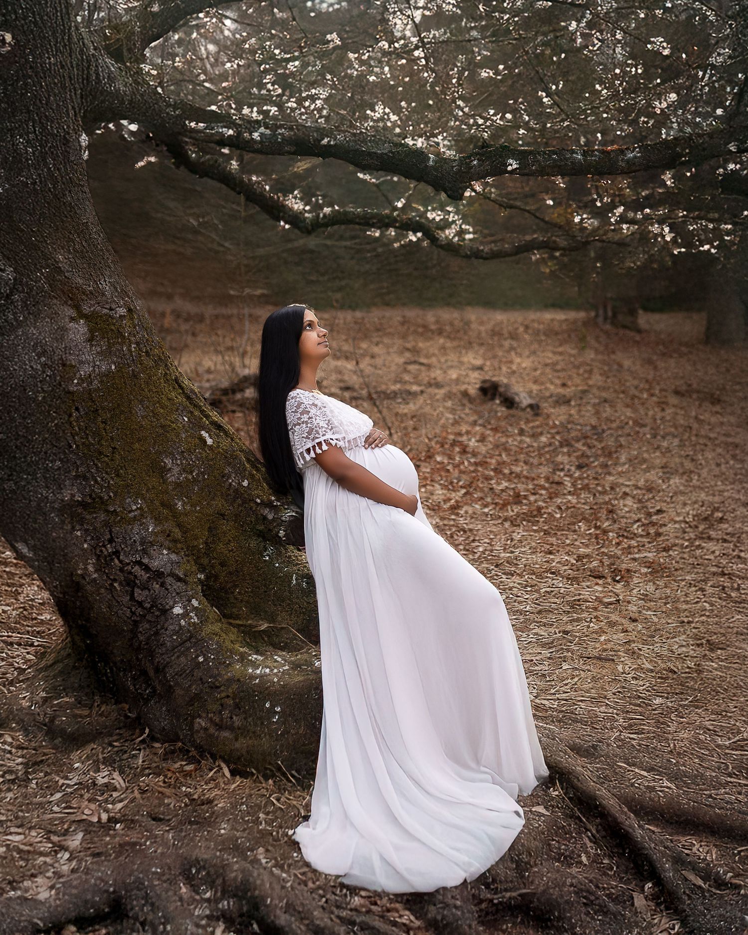 A series of artistic maternity photos showing a woman in a flowing white dress posed against natural outdoor settings.