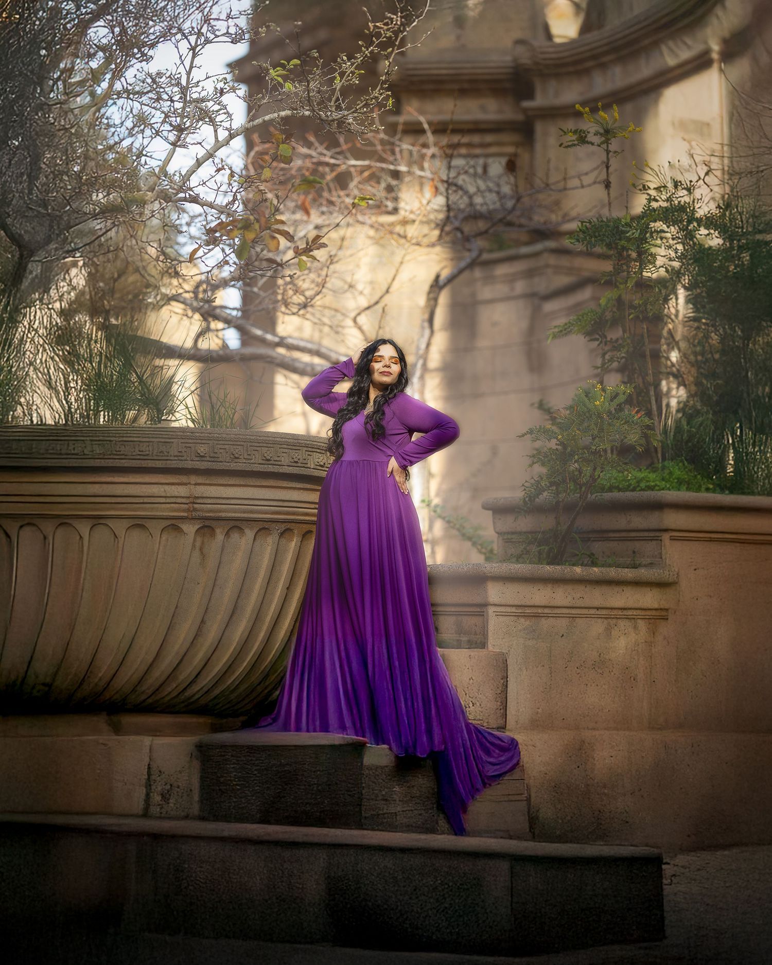 A sequence of artistic shots featuring a flowing purple dress against stone architectural elements in natural light.