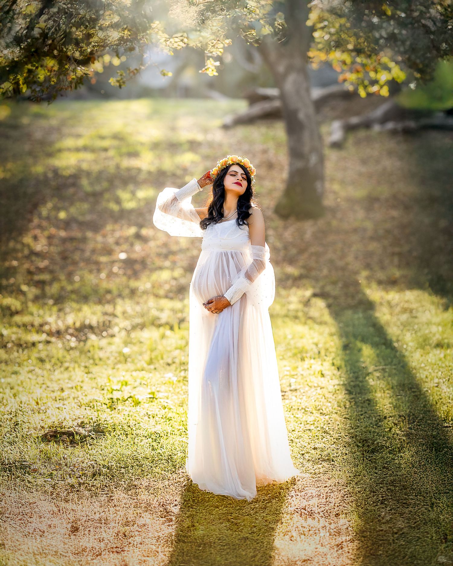 Ethereal white dress flows in golden sunlight beneath autumn trees on a dreamy forest path.