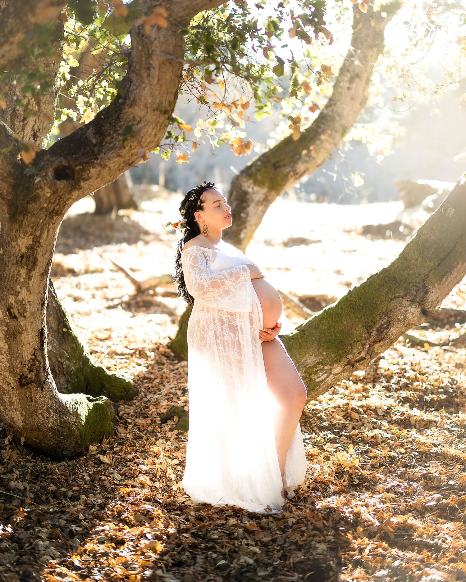 A dreamy outdoor photo series shows a person in a flowing white dress playing among autumn leaves and sunlit trees.
