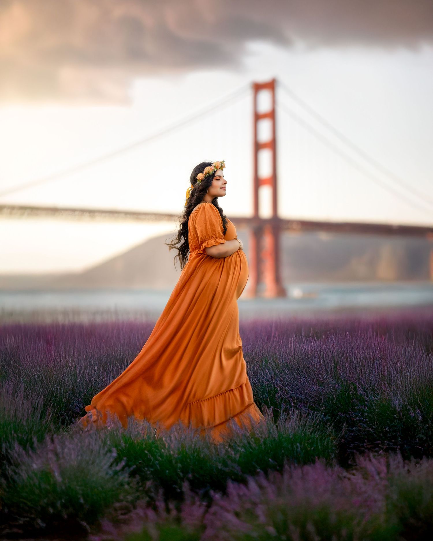 A flowing orange dress contrasts beautifully against purple lavender fields with the Golden Gate Bridge in the background.