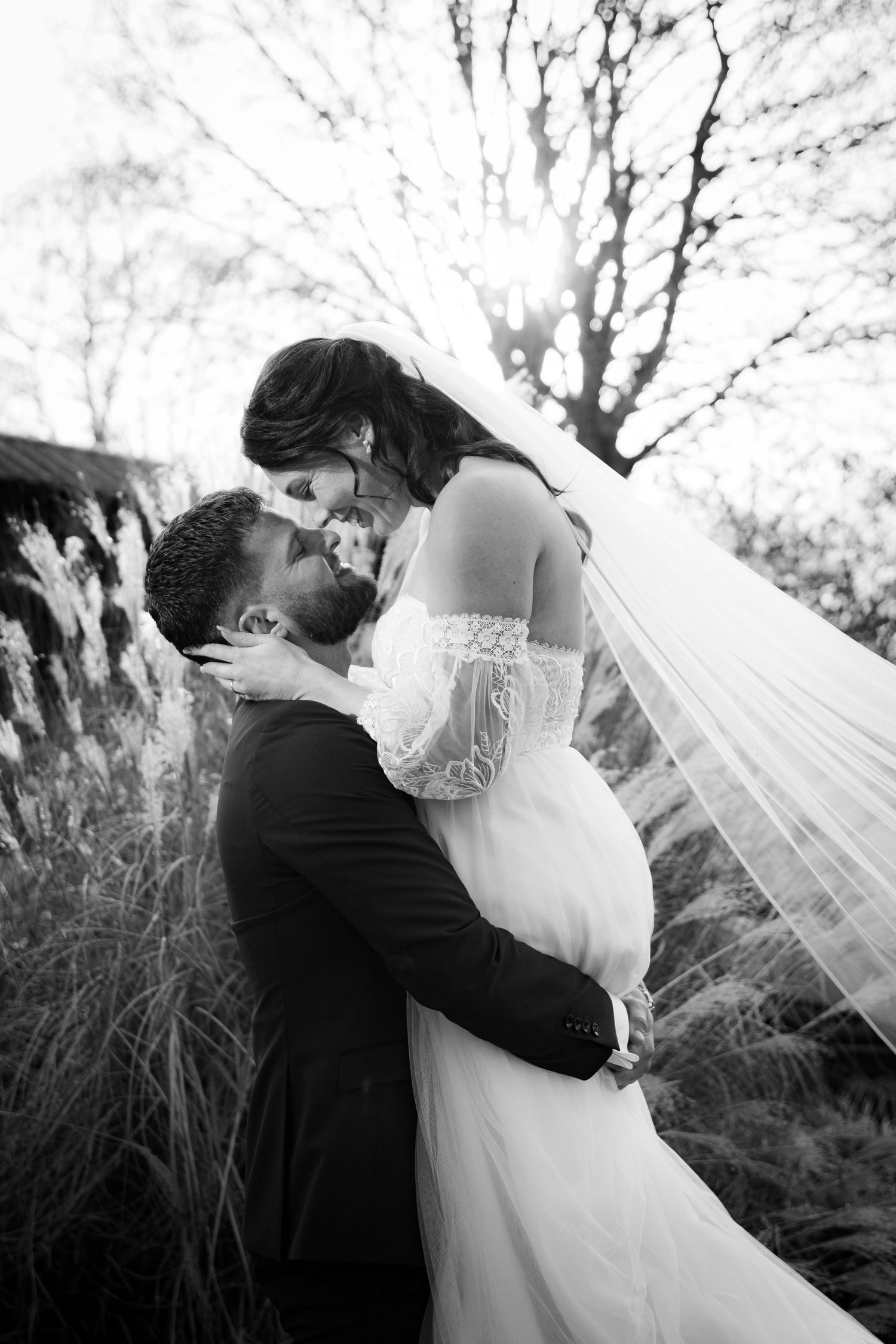 Series of intimate black and white wedding photos showing tender moments between newlyweds.