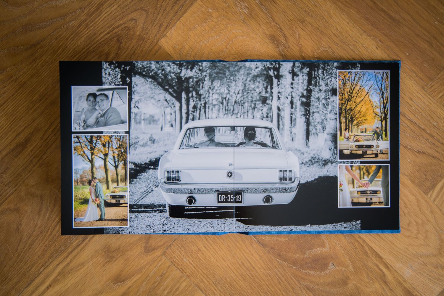 Framed artwork shows a vintage white car on a snowy road with smaller autumn-themed photographs on the sides.