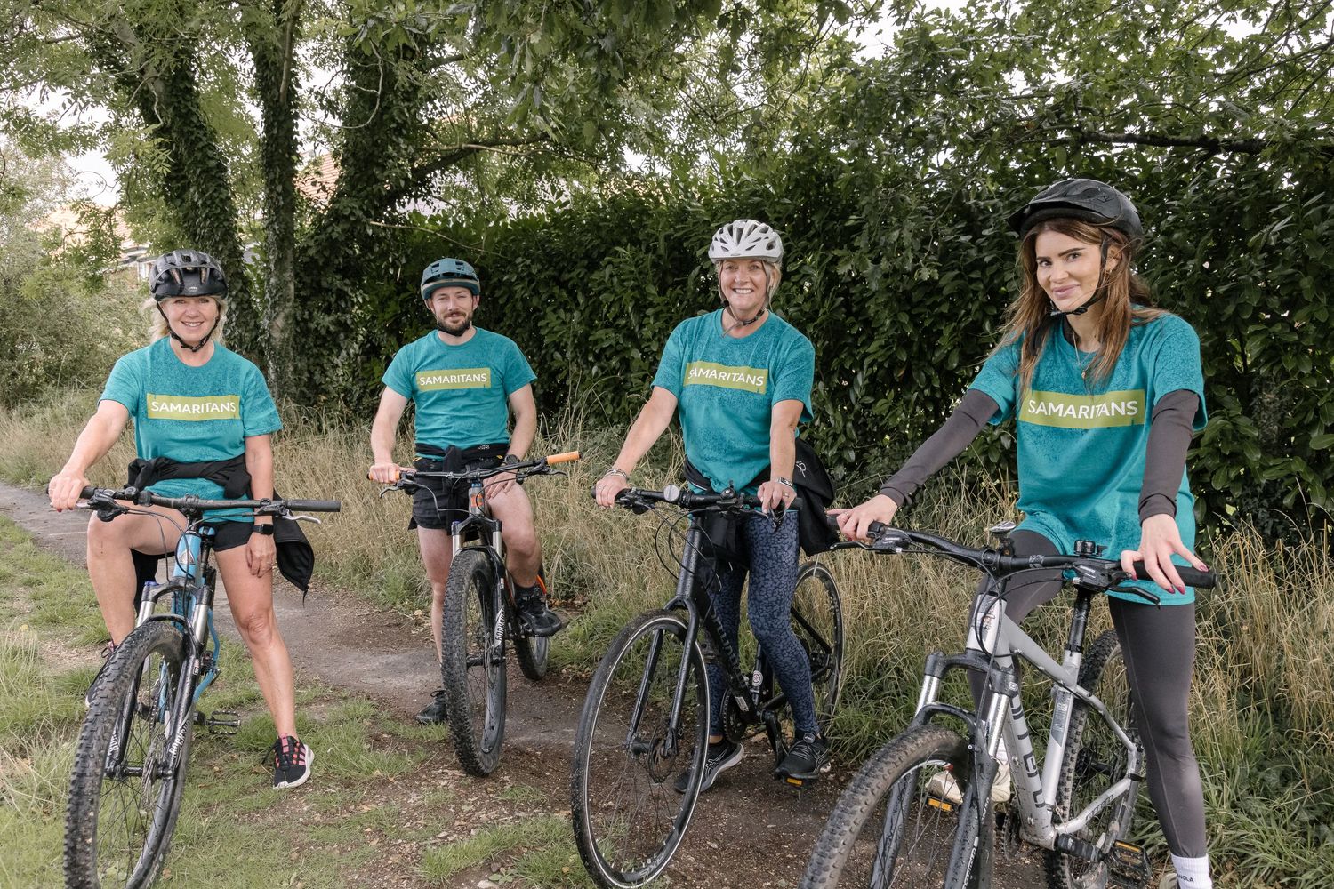 Volunteers taking part in a charity bike ride.