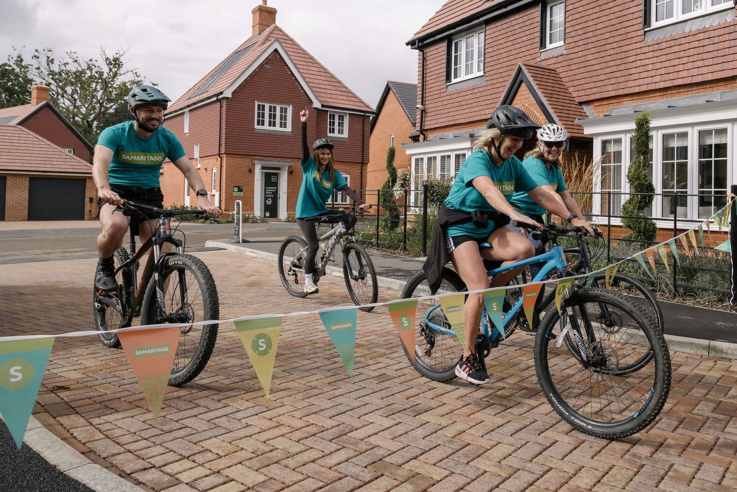 Volunteers taking part in a charity bike ride.