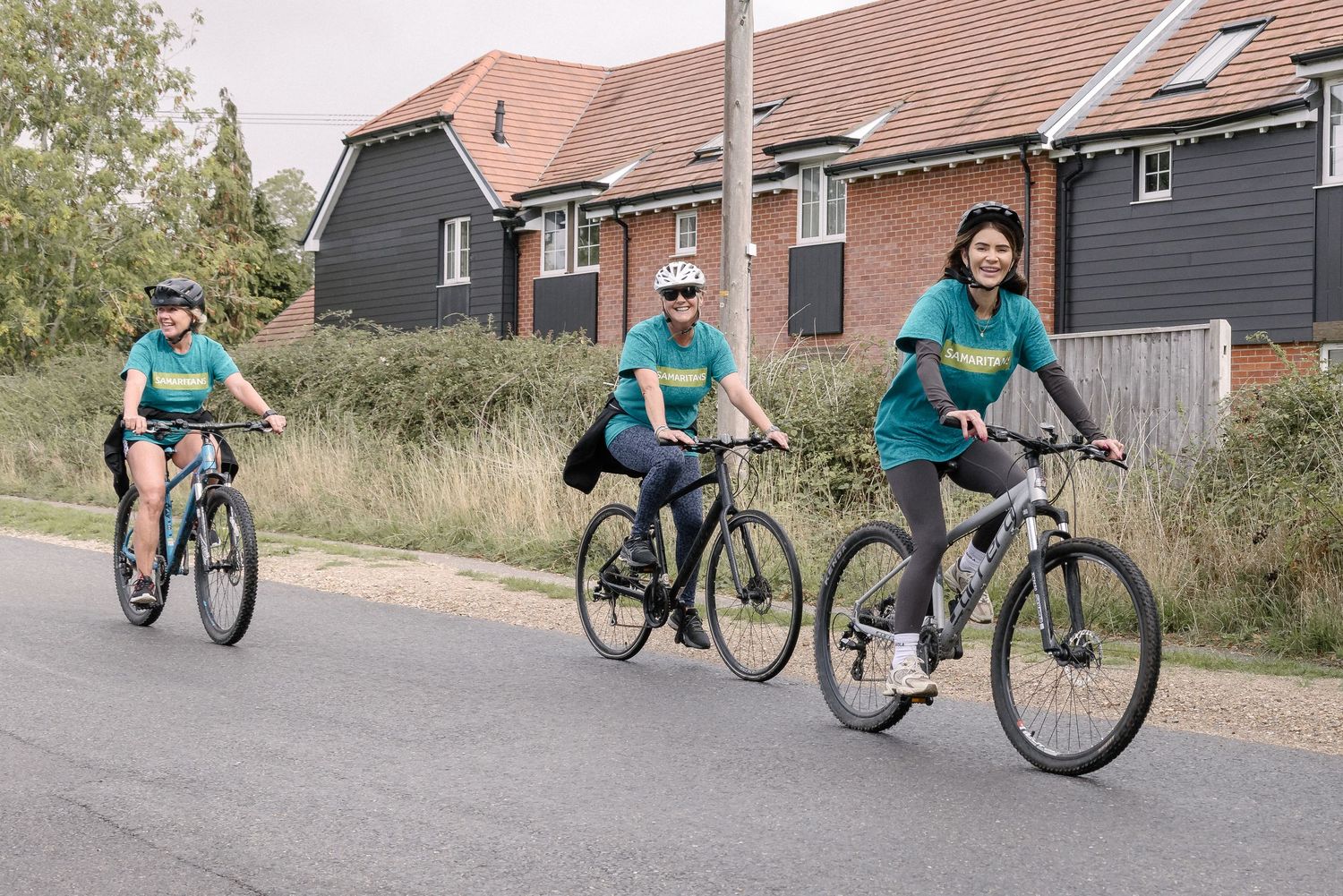 Volunteers taking part in a charity bike ride.