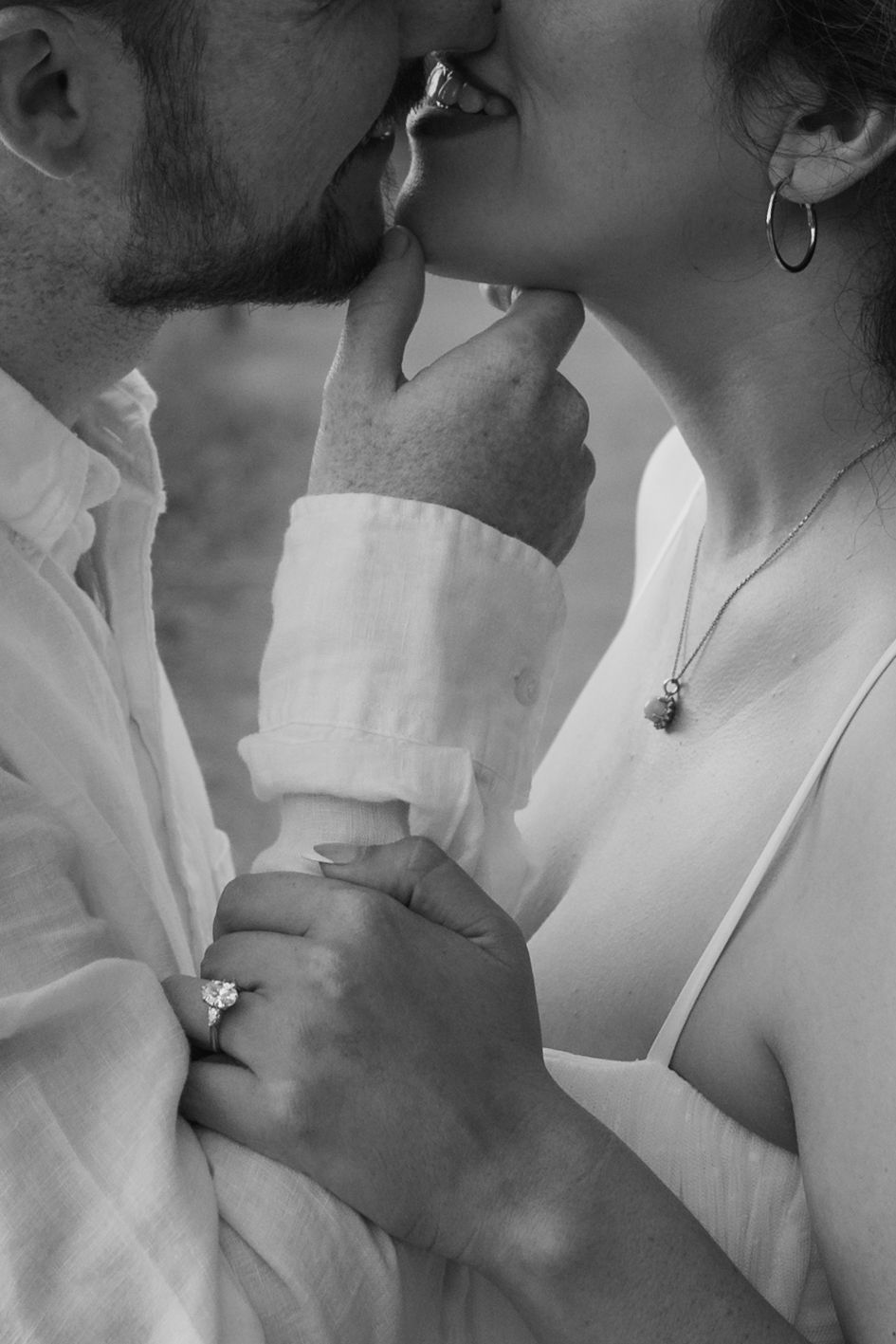 close up of a man an woman about to share a kiss holding each other in a tender embrace