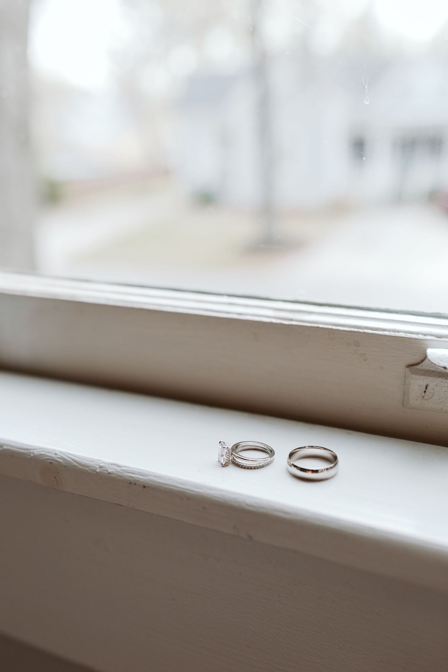 Close up shot of earrings on a window still