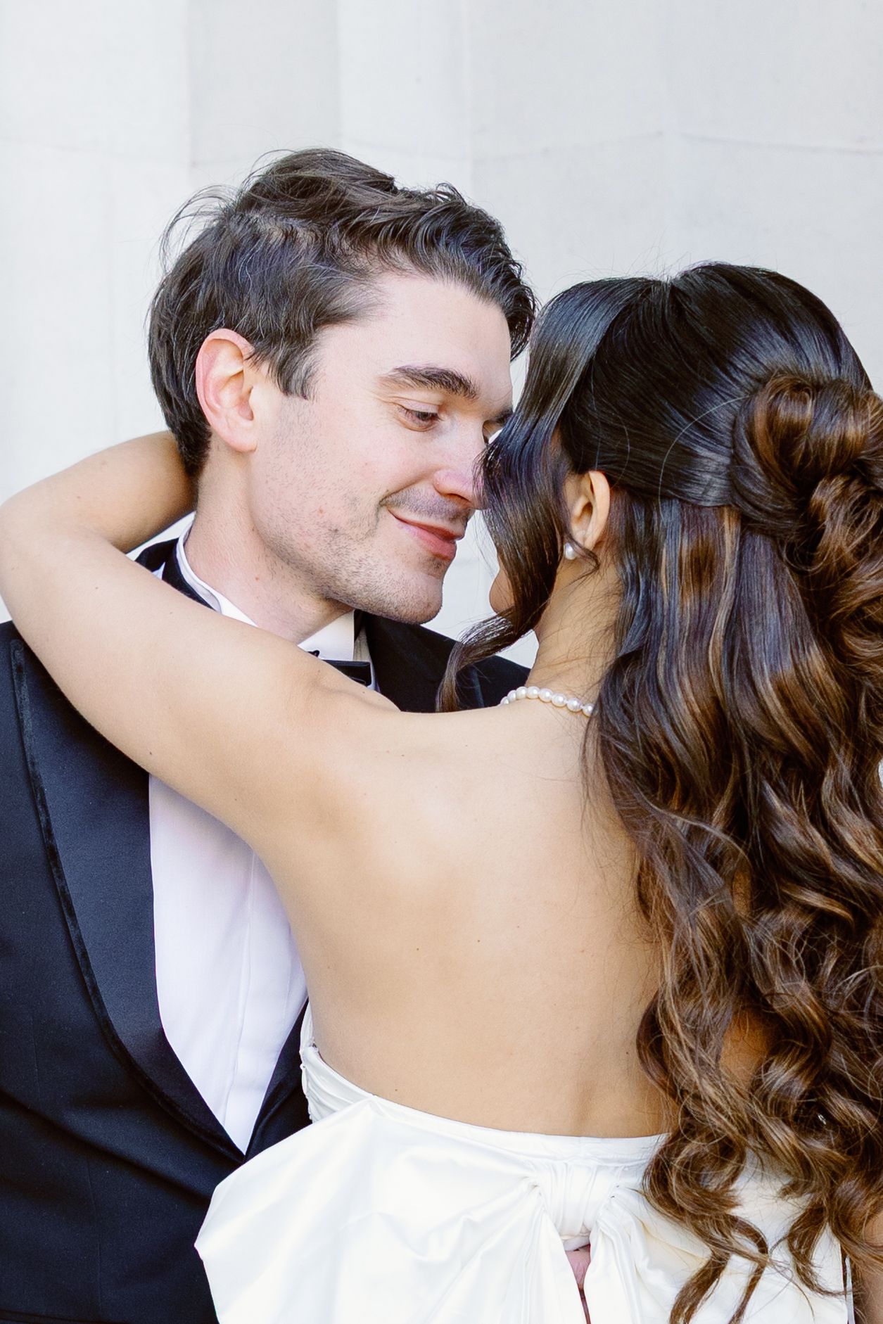 A romantic series of photos showing a couple in formal attire sharing an intimate kiss.