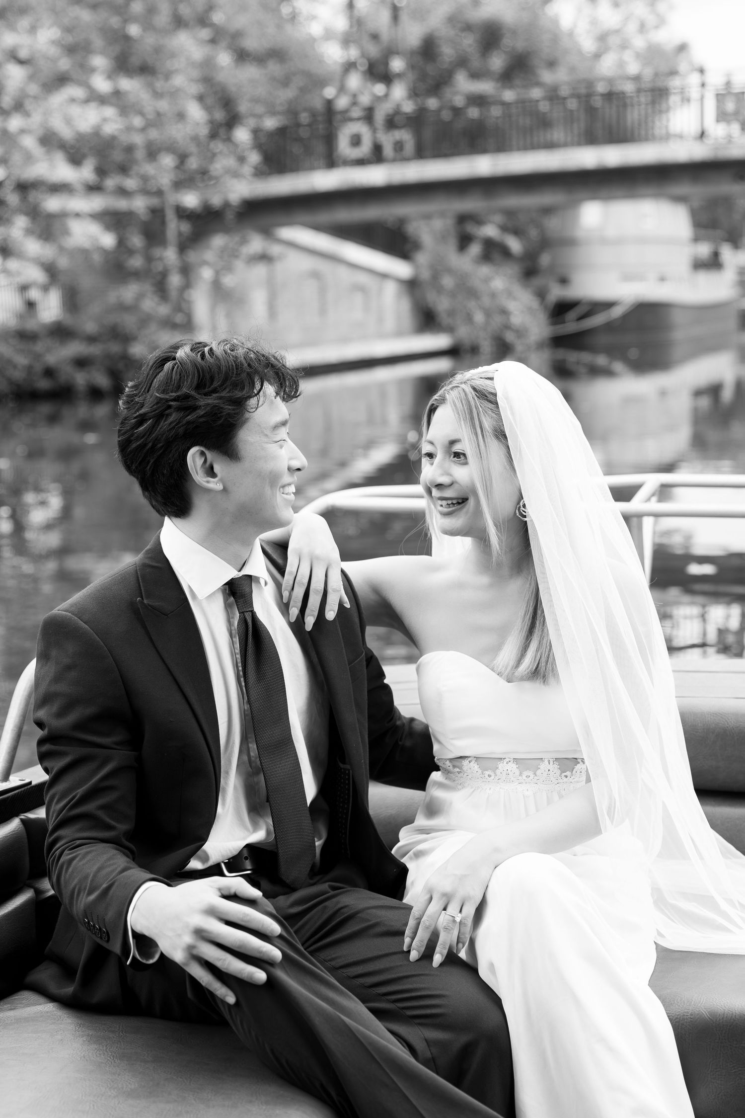 Black and white wedding portraits showing tender moments between newlyweds.
