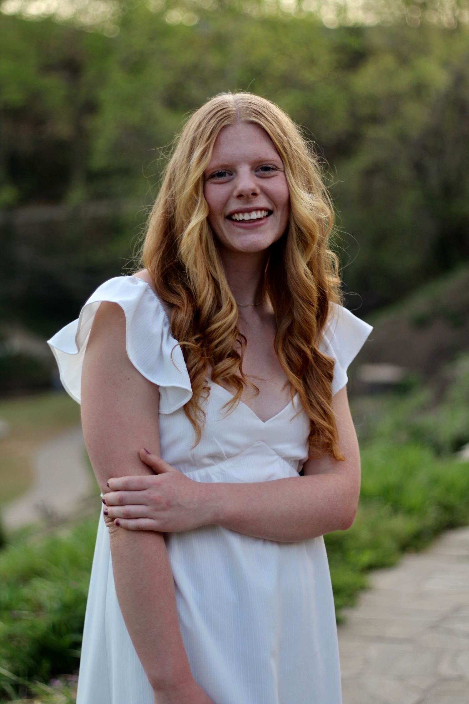 She's beautiful in a white gown in Falls Park.