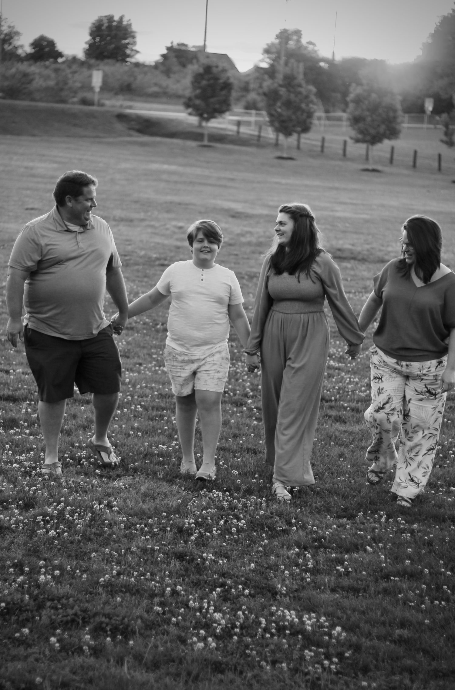 Family walking together in black and white at Lake Robinson.