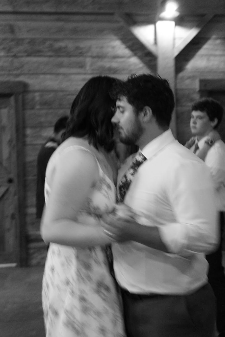 Romantic couple dancing in black and white. Motion blur.
