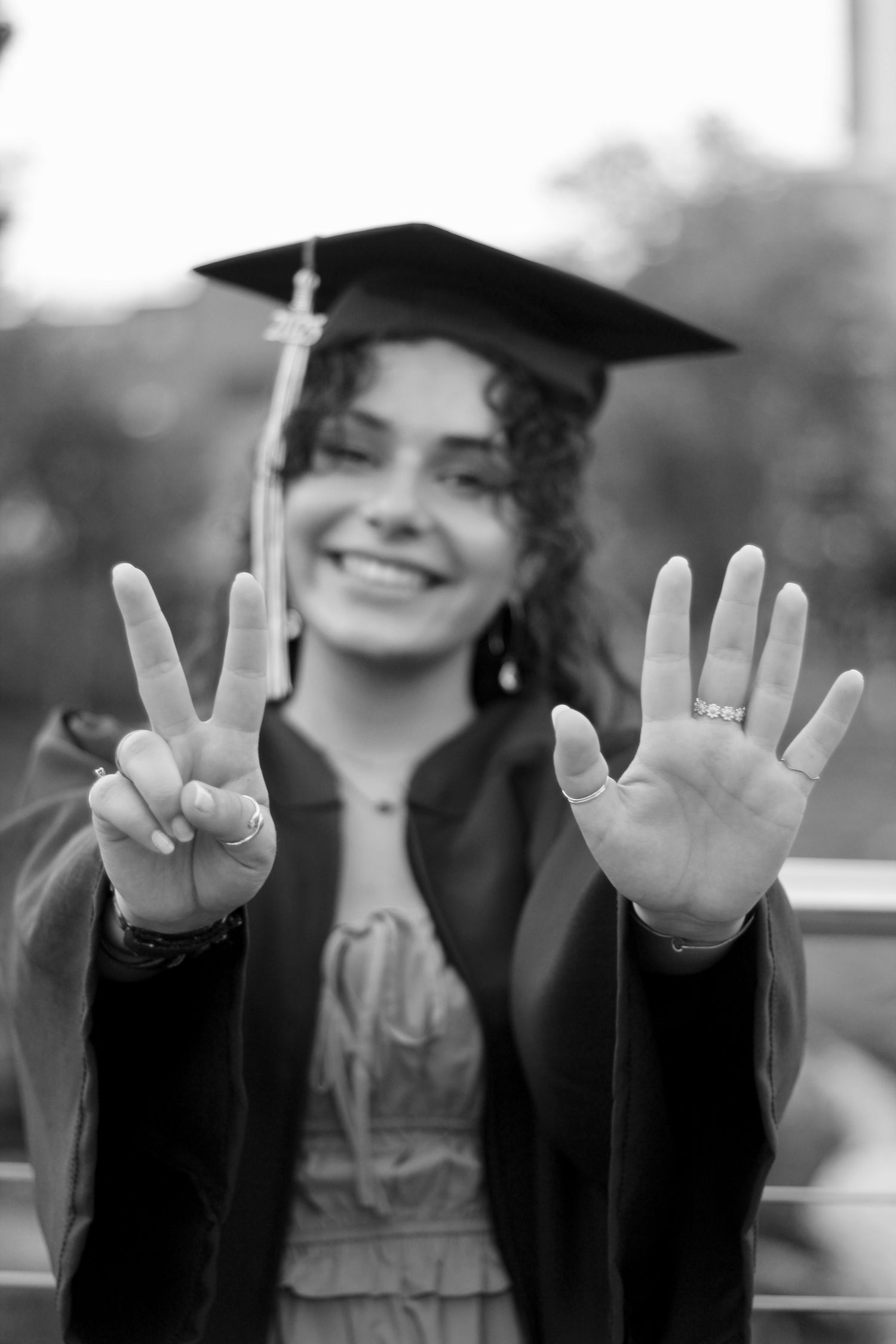 Class of 2025, she holds up her hands to show up the date.