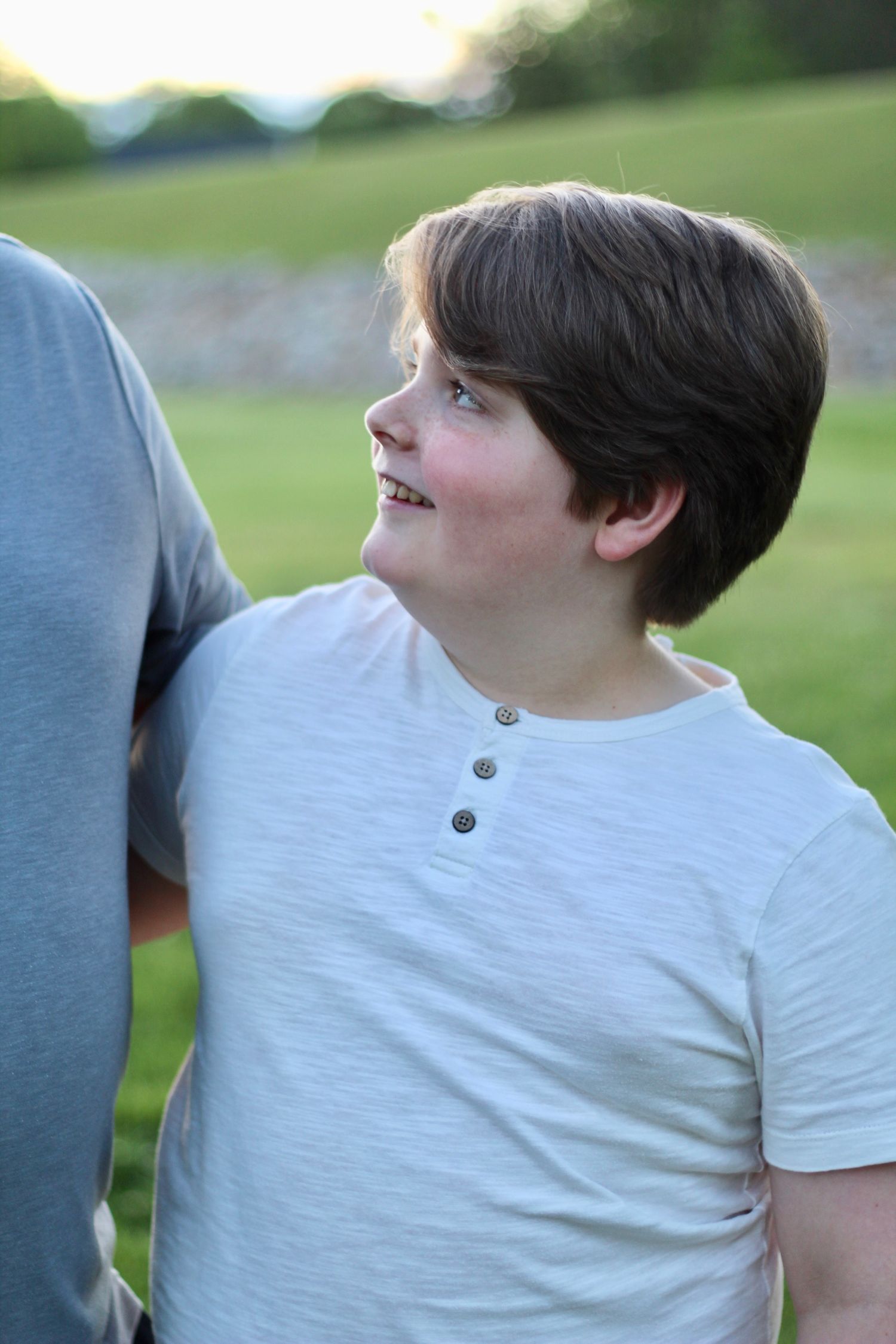 A son looking up at his dad.