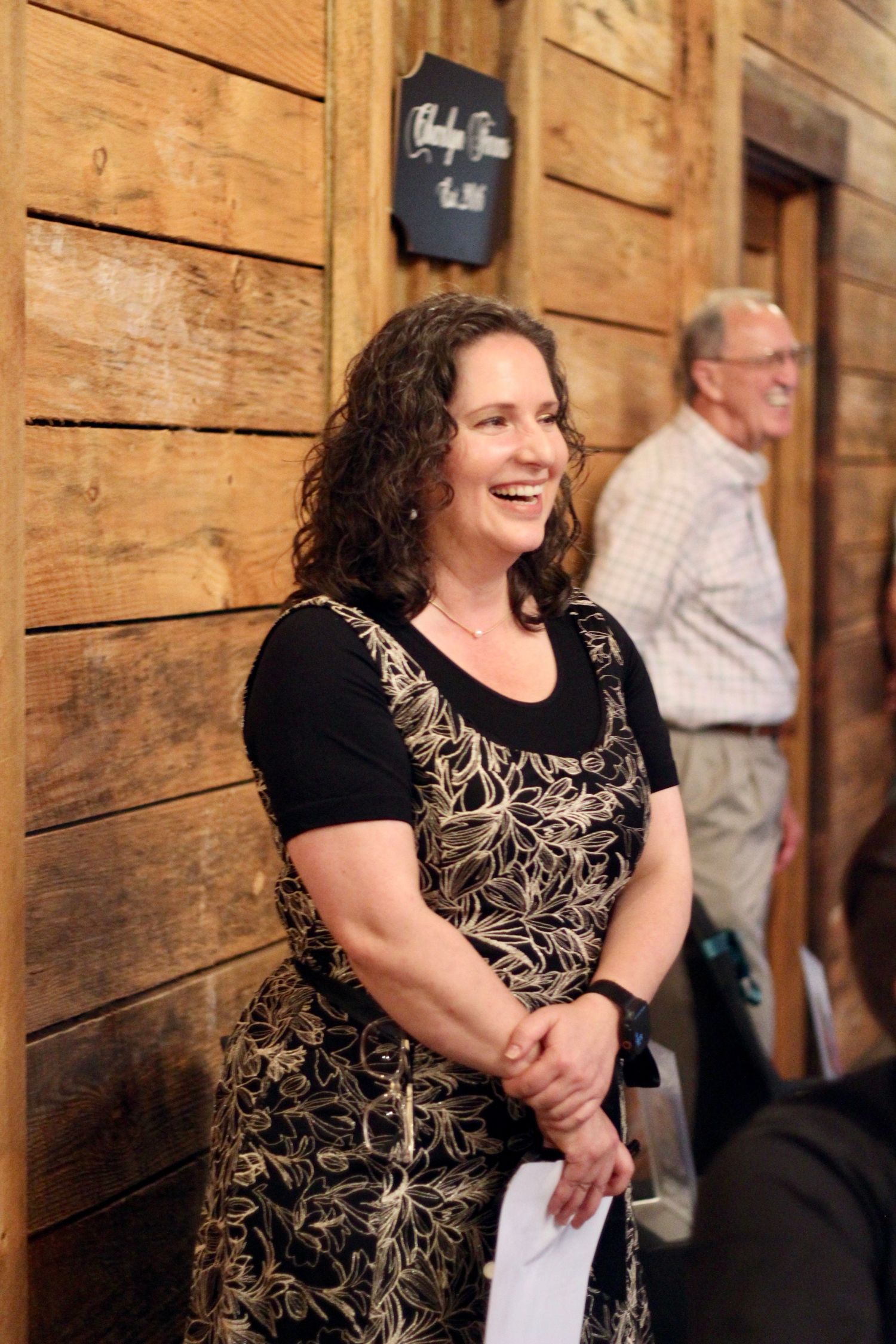 Mom of the groom laughs.