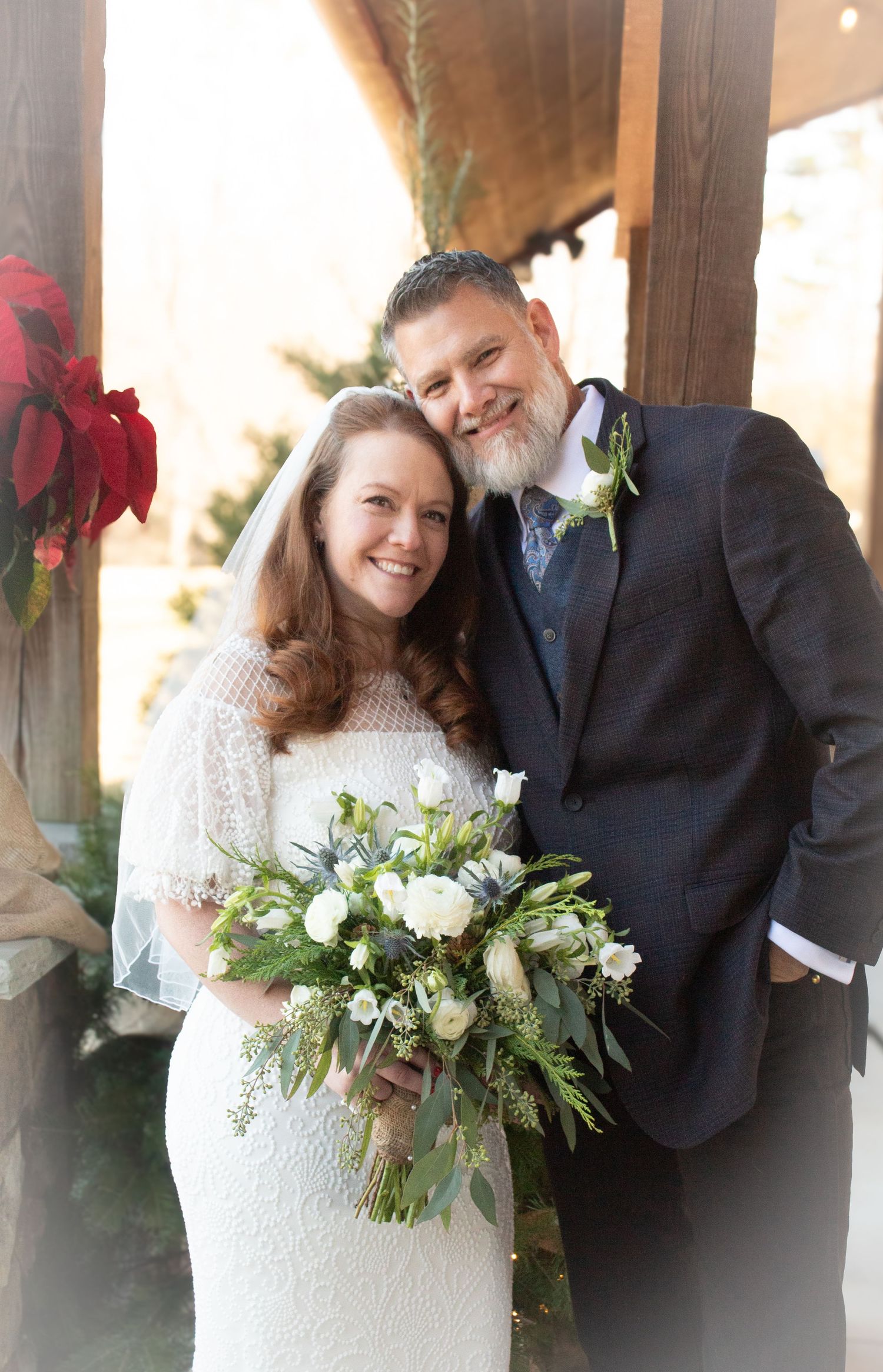 Bride and groom looking all smile-y at the camera.