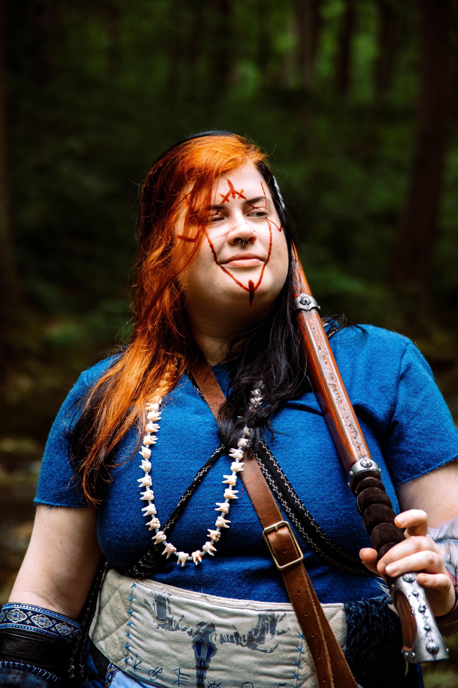 A sequence of four photos showing a musician in a blue shirt playing a wooden flute outdoors in a forest setting.