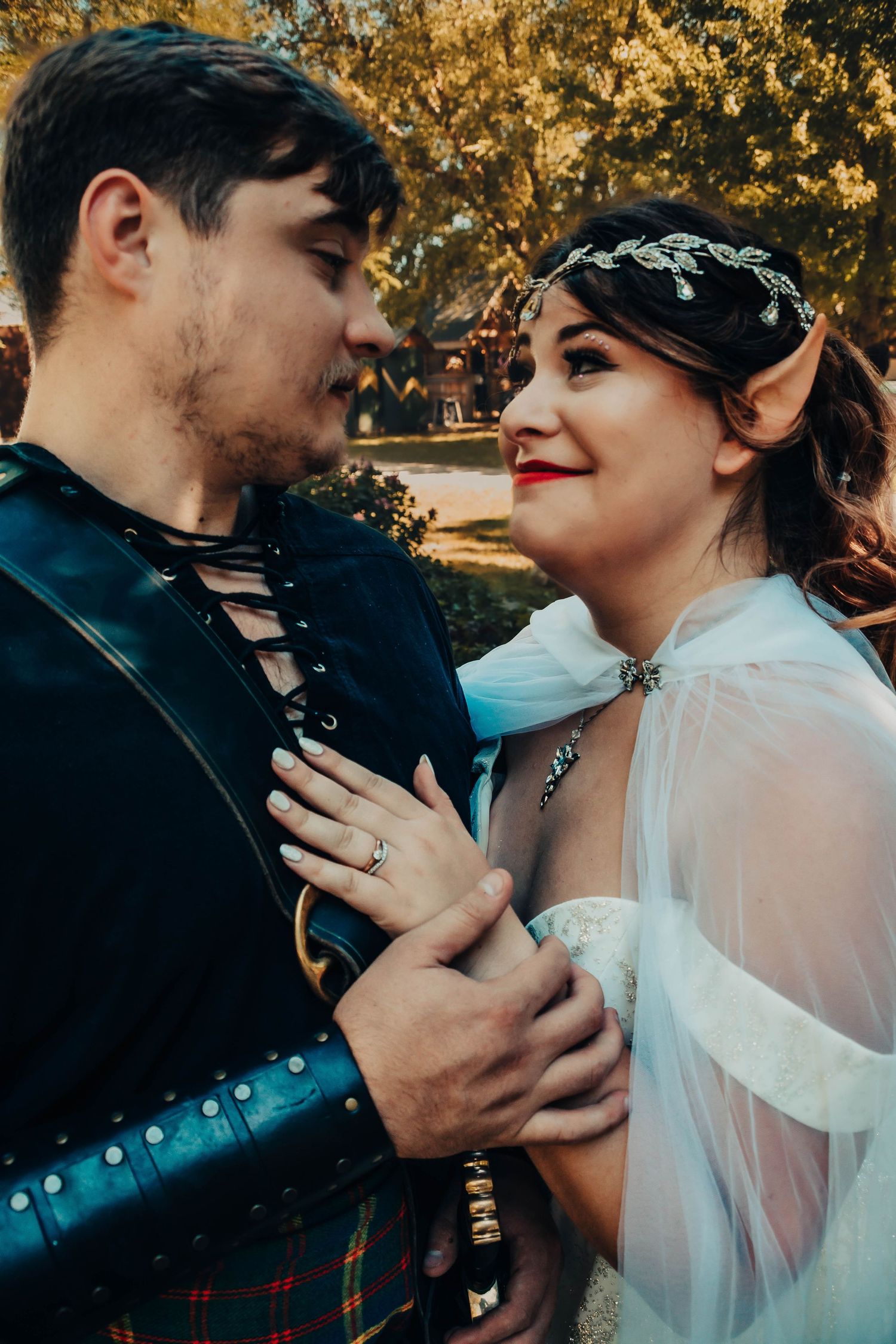 A romantic sequence of intimate moments between a couple in wedding attire with autumn foliage in the background.