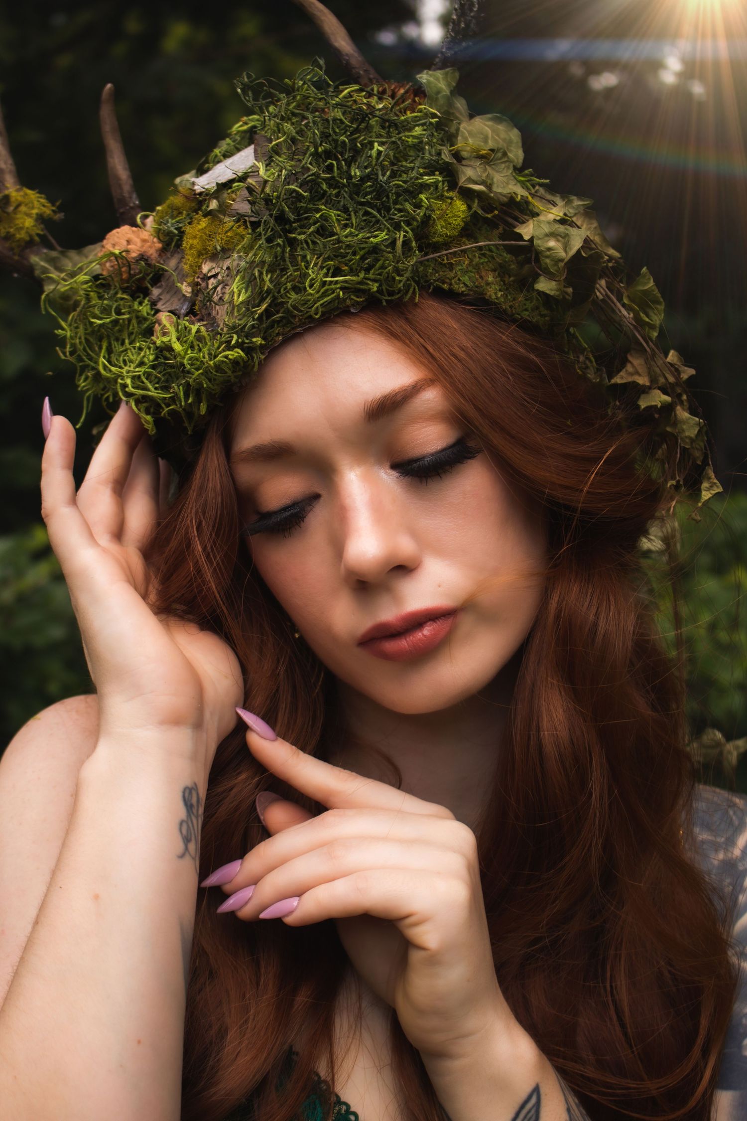 A dreamy portrait series of a woman wearing a leafy crown in soft sunlight against a natural backdrop.