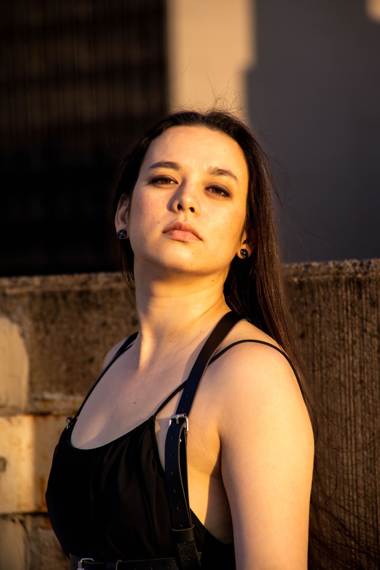 Artistic portrait sequence captured in golden hour lighting with dramatic shadows and contrast.