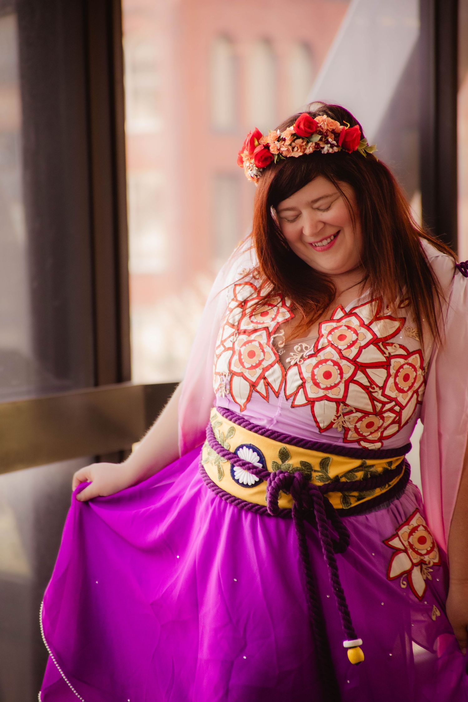 Cosplay portraits in ornate pink and purple dress with floral crown and decorative details.