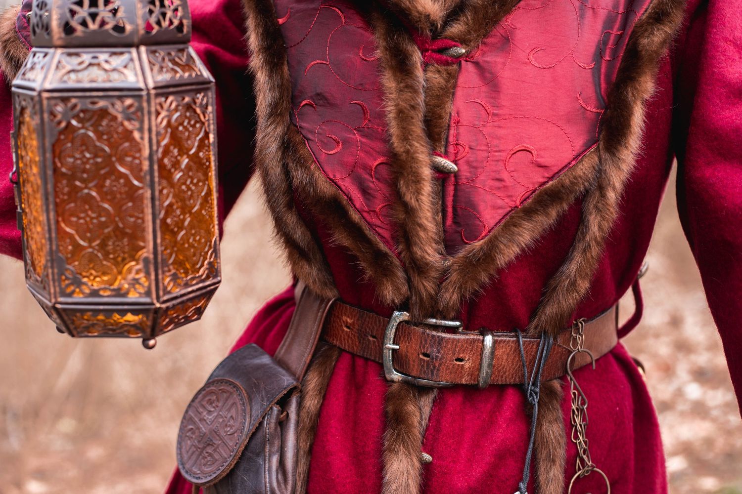 A close-up view of traditional Mongolian horse riding gear including ornate leather saddles and bridles with red details.