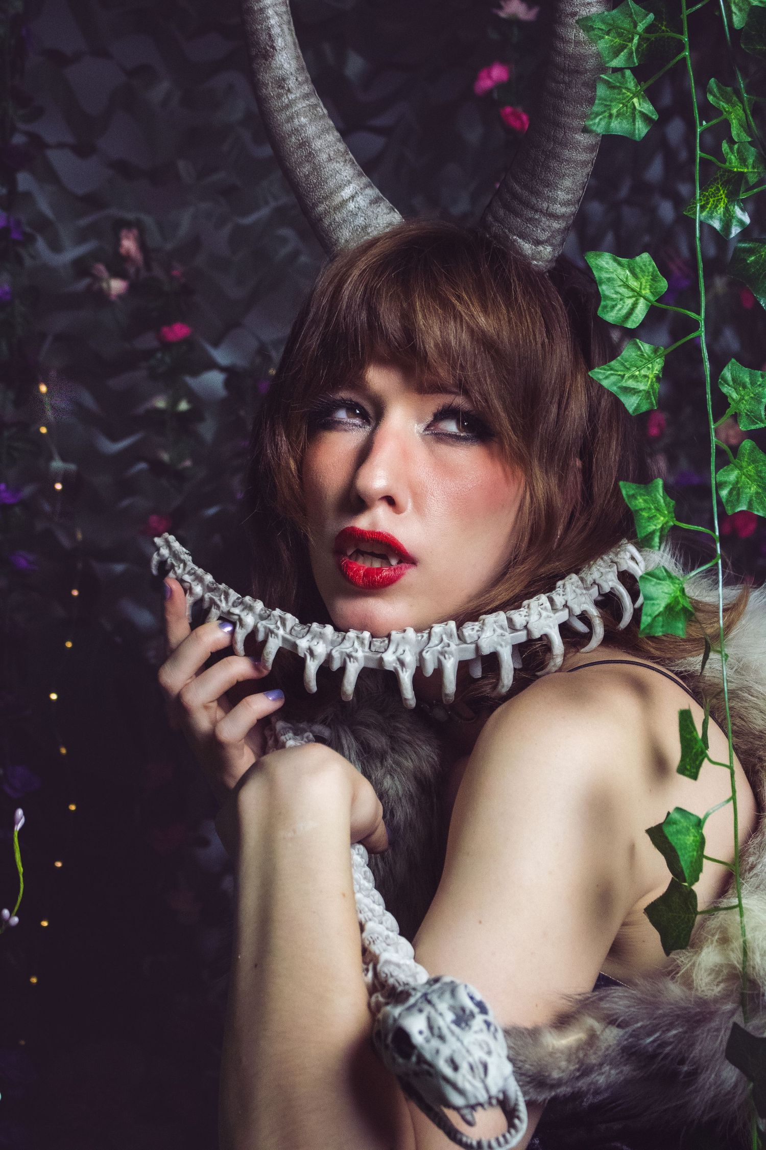 Artistic portrait series showing dramatic poses with lace choker against dark background with green ivy leaves.