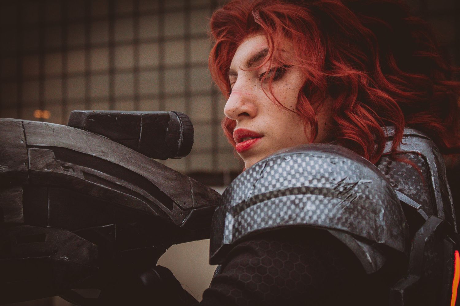 Dramatic cosplay portraits with red hair against textured background.