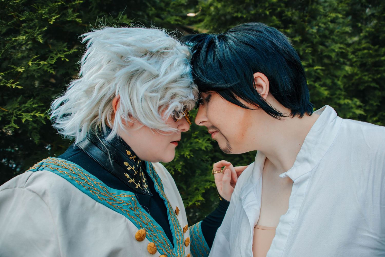 Ethereal fantasy cosplay scene with white and silver styling in garden setting.