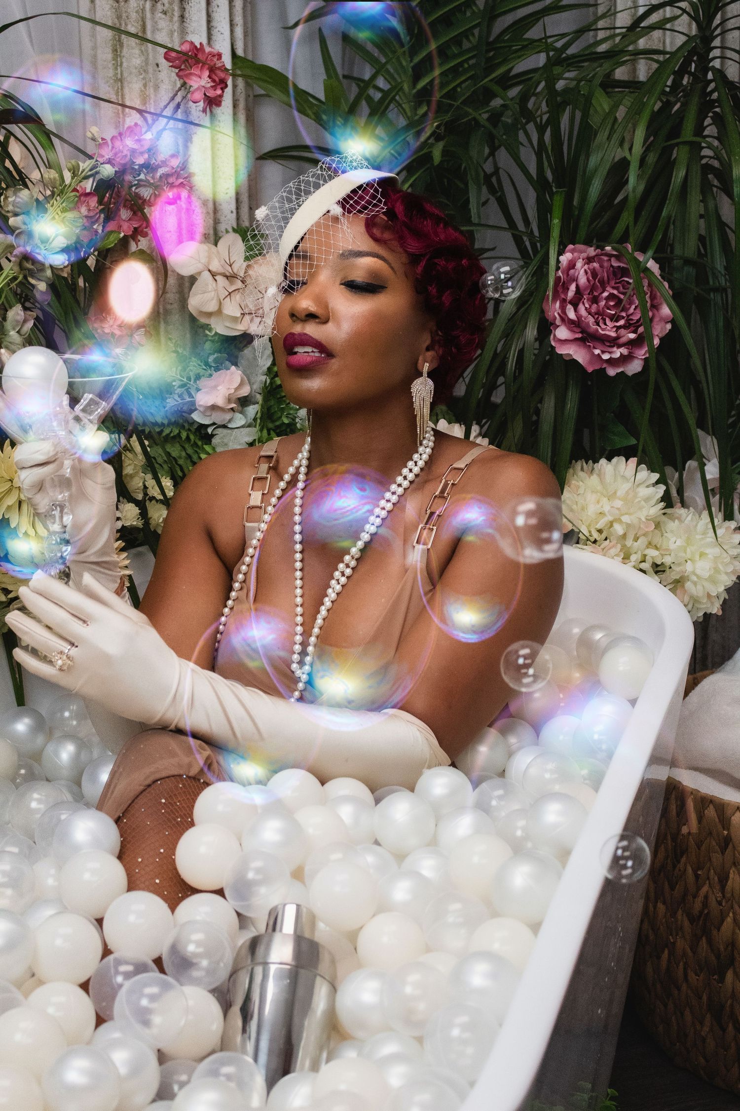 Dreamy bubble bath scene with iridescent lighting and pearl necklace details.
