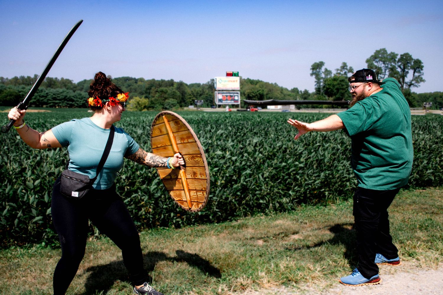 A sequence of photos showing someone throwing a boomerang in an open field with green vegetation.