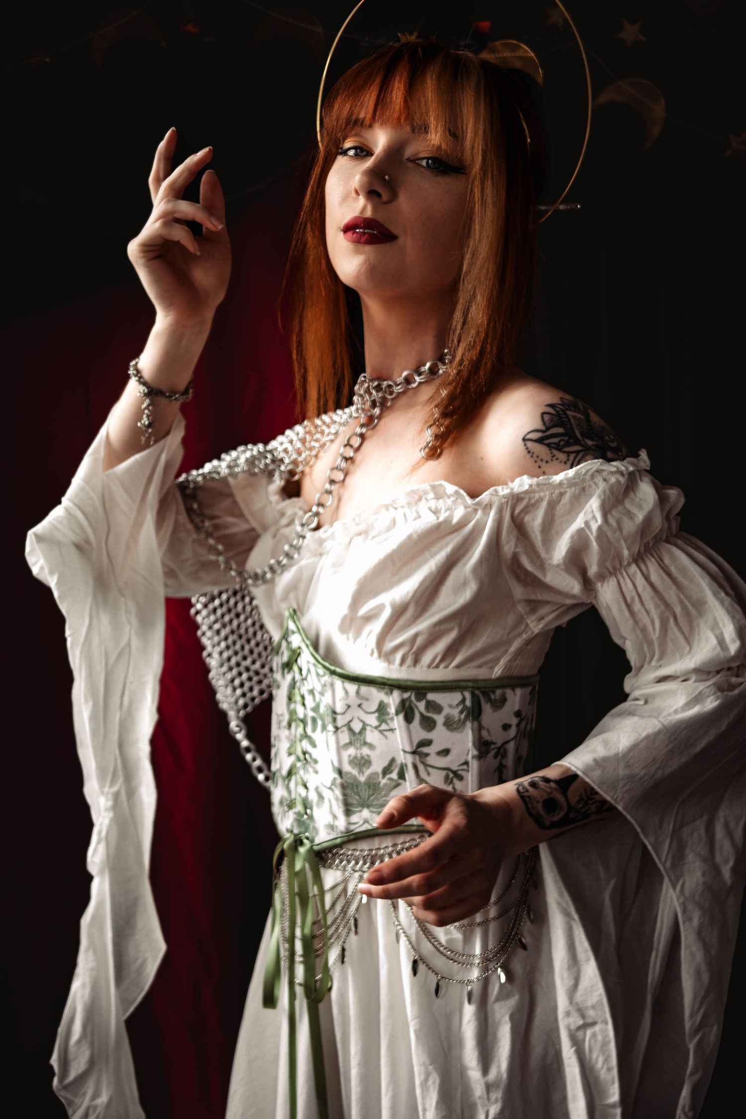Victorian-inspired portrait with white corset dress, pearls and dramatic lighting.