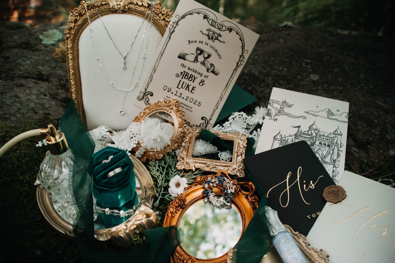 Vintage-inspired wedding decor featuring ornate gold frames, teal accents, and elegant calligraphy on paper.