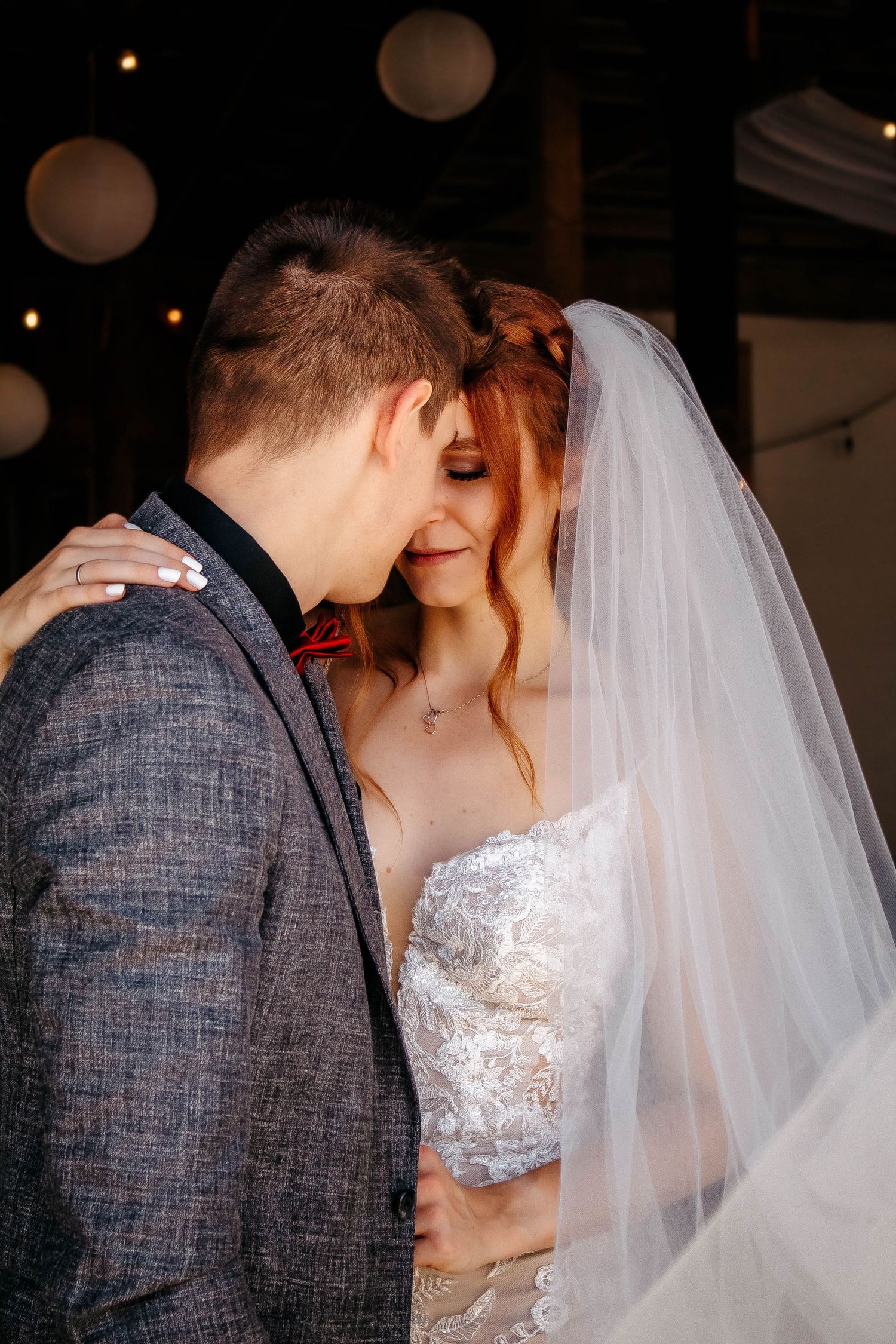 A romantic wedding couple shares intimate moments in a series of candid photographs showing tender kisses and embraces.