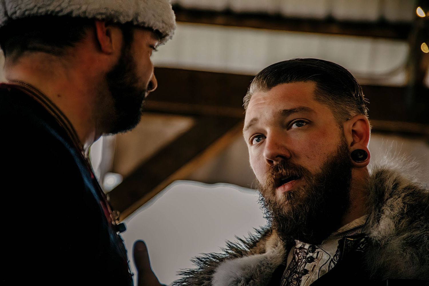 A series of close-up shots showing bearded men in profile against a dark background.