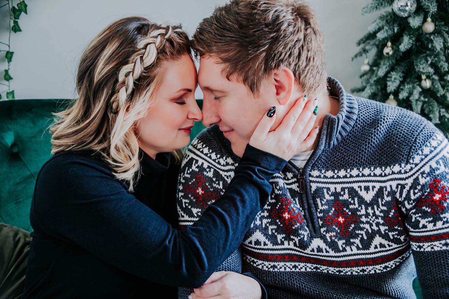 Cozy winter couple photos featuring festive Nordic sweaters and intimate poses.