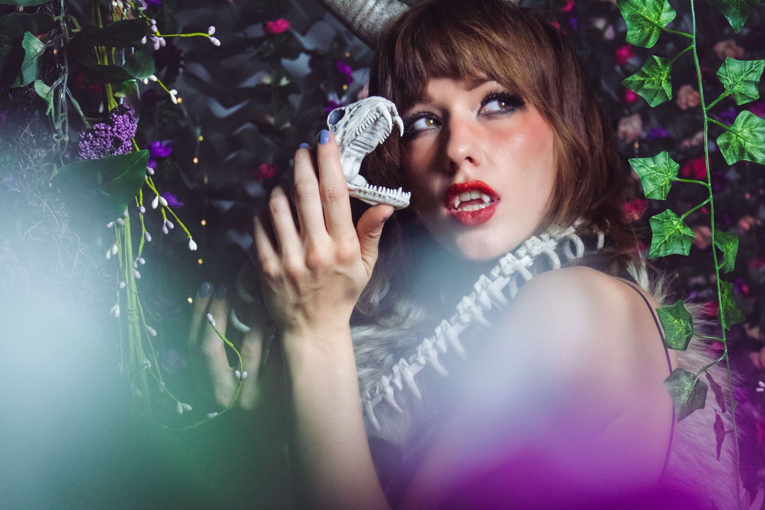 Dreamy portrait series with purple and green botanical elements in soft focus.
