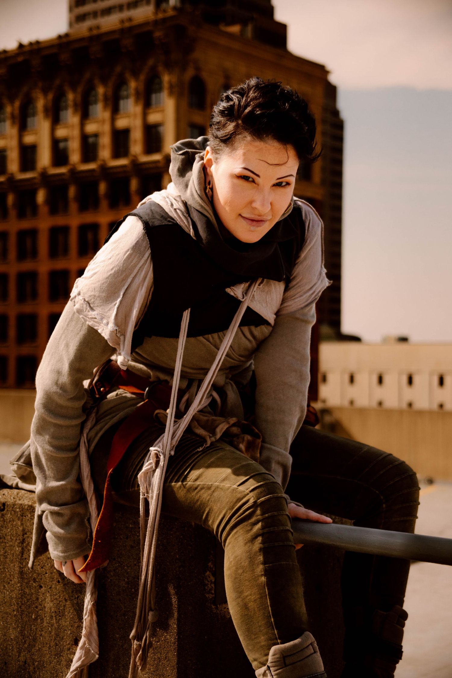 Urban fashion photography featuring casual streetwear and dynamic poses against architectural backdrop.
