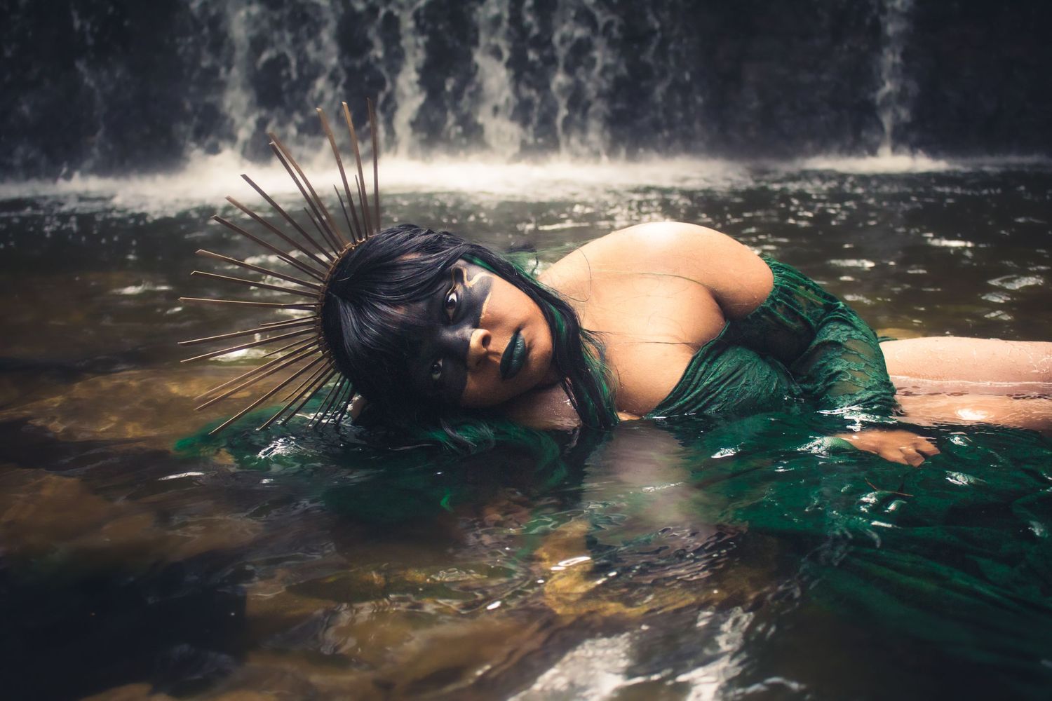 Artistic underwater photography with emerald green tones creating a dreamy aquatic scene.