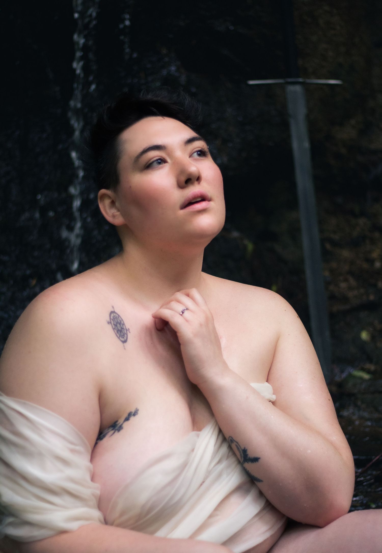 Artistic boudoir portrait with soft lighting and natural poses.