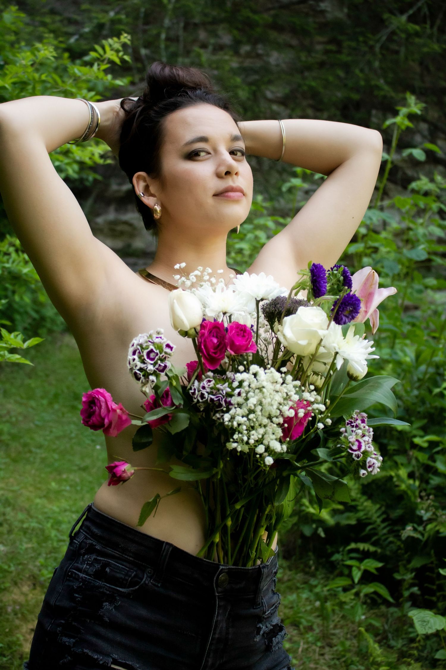 Summer garden portrait with colorful flower bouquet featuring roses and baby's breath.