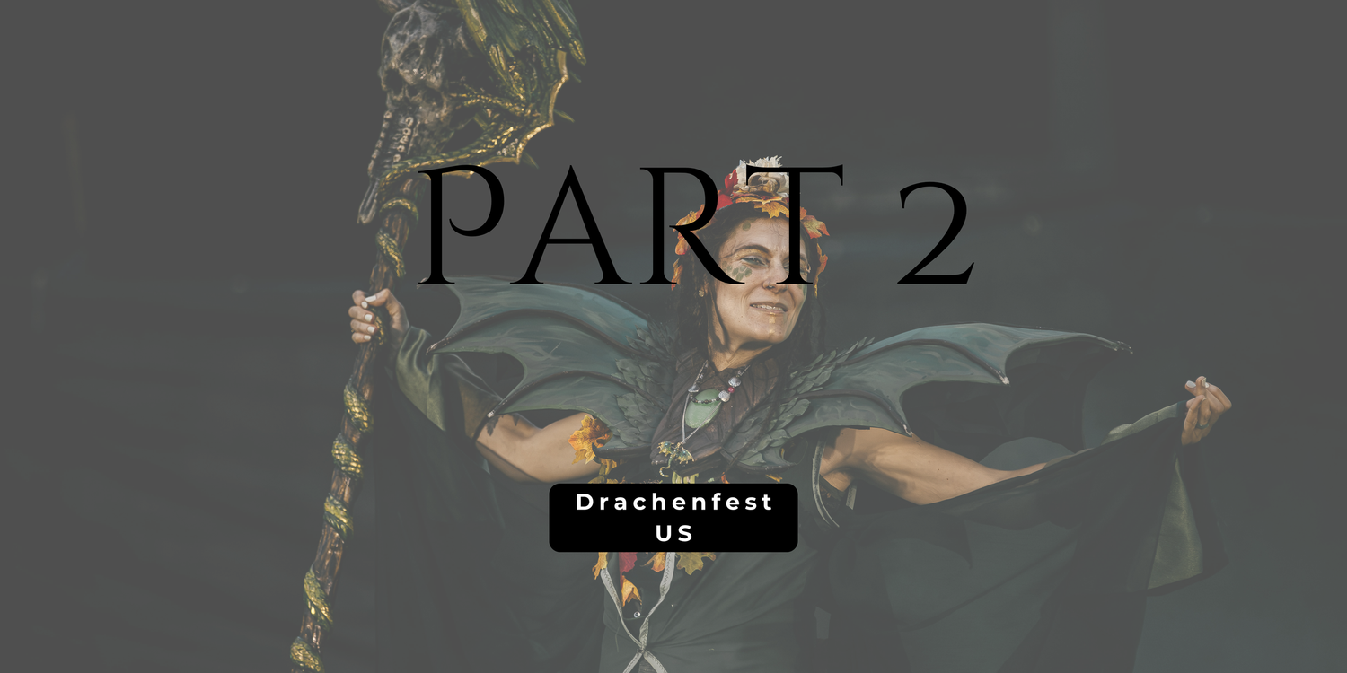 A costumed performer in dark fantasy armor holds a staff at Drachenfest US Part 2 LARP event.