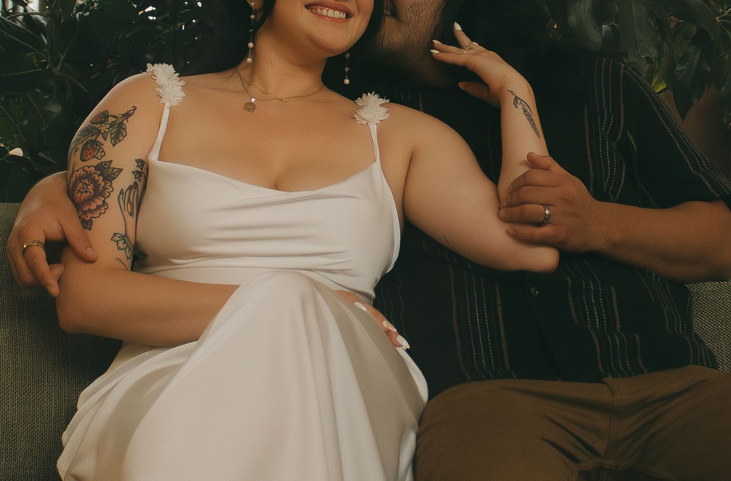 Close up shots showing details of a person in a white formal dress against a dark background.