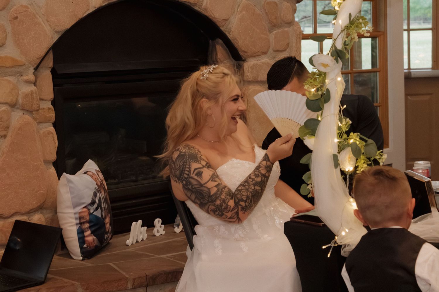Wedding reception venue decorated with rustic stone walls and natural lighting.