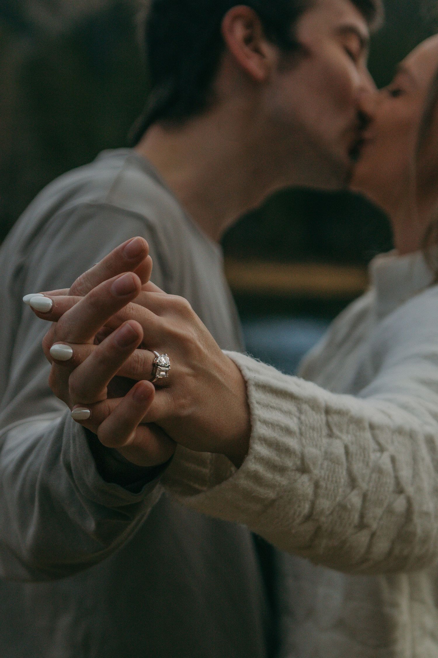 Close-up sequence of hands showing an engagement ring during a romantic proposal moment.
