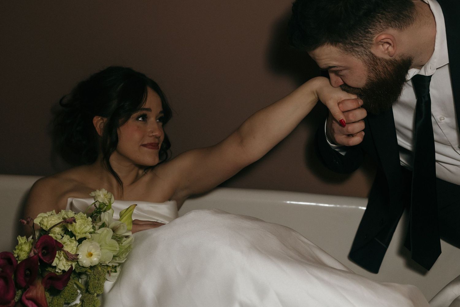 A wedding couple dances together in an intimate moment during their first dance at their reception.