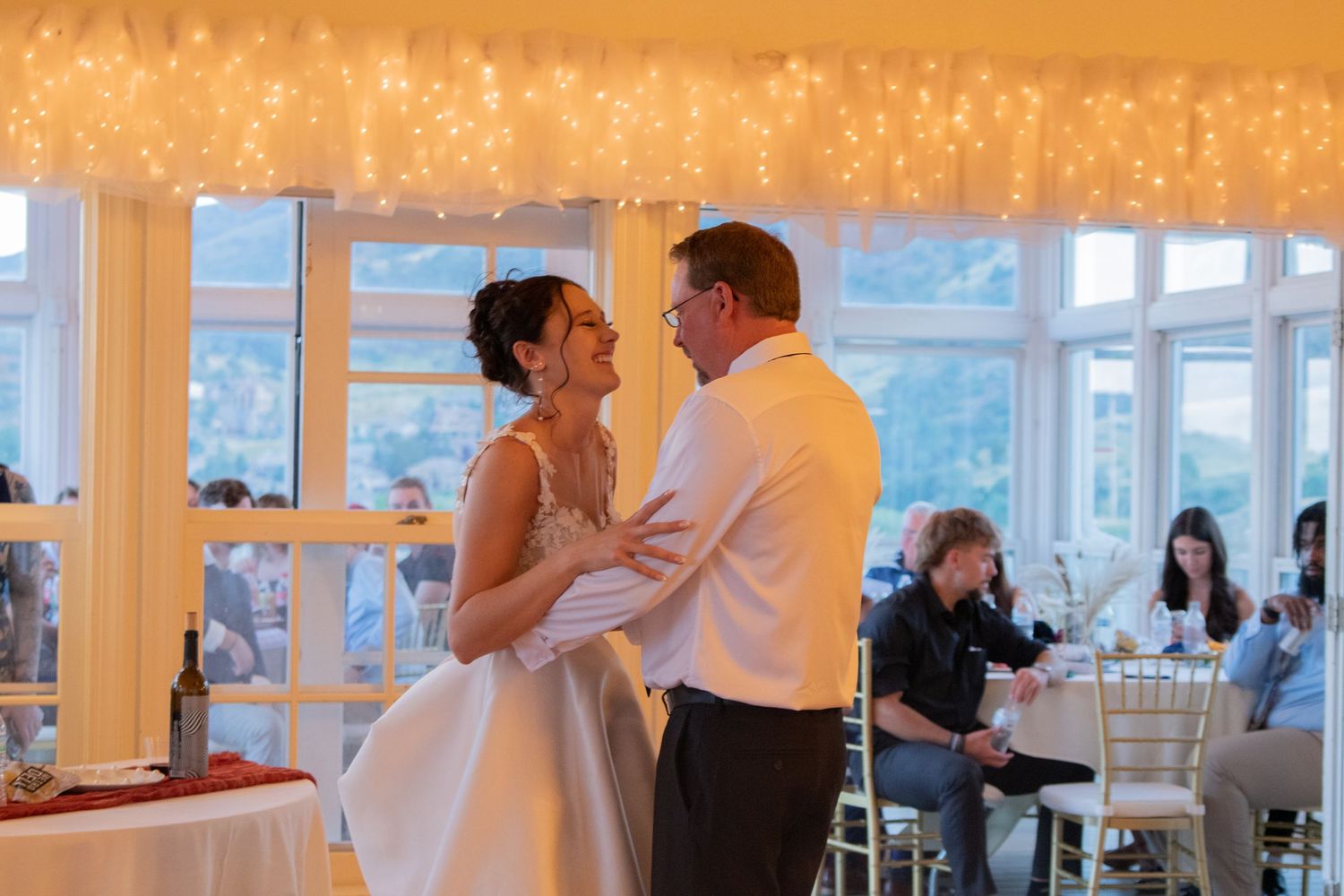 Wedding reception venue with warm lighting and elegant decor.