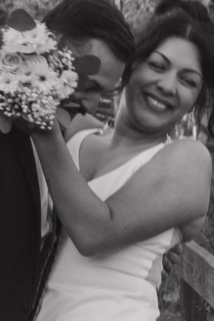 A joyful wedding celebration moment captured in black and white.