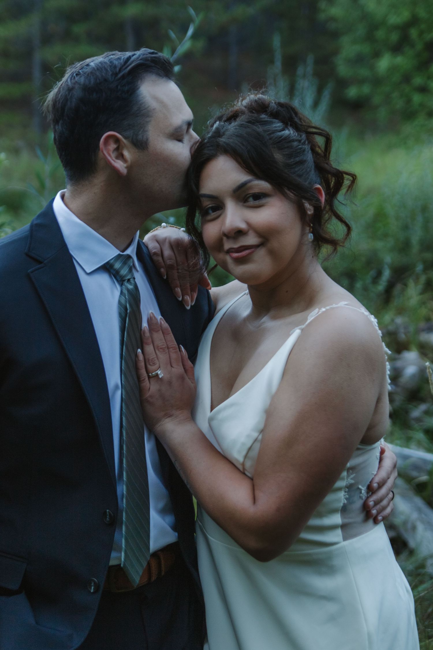 A joyful wedding moment captured in natural outdoor lighting.